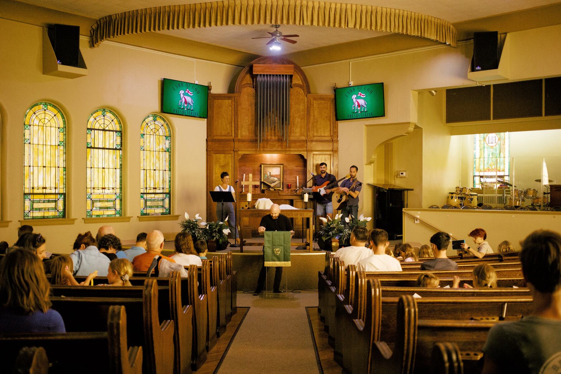 The congregation gathered for worship in the sanctuary, with the band leading from the front.